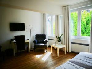 Ένα ή περισσότερα κρεβάτια σε δωμάτιο στο Bartmanns Haus & Schwan GmbH