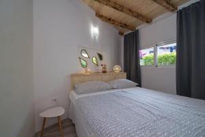 Ένα ή περισσότερα κρεβάτια σε δωμάτιο στο Alice A1