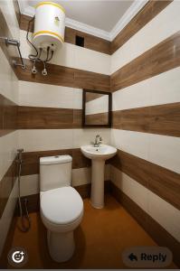 a bathroom with a toilet and a sink at Sagar Niwas in New Delhi +37 photos