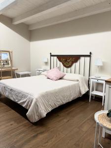 Ένα ή περισσότερα κρεβάτια σε δωμάτιο στο Borgo Nocchiara