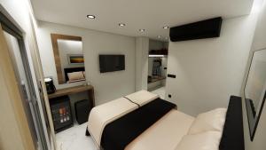 Телевизор и/или развлекательный центр в Black Rocks Beach Resort +15 фотографий