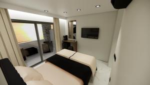 Кровать или кровати в номере Black Rocks Beach Resort