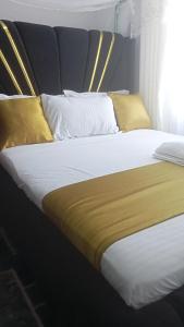 Ένα ή περισσότερα κρεβάτια σε δωμάτιο στο Fp&b apartments