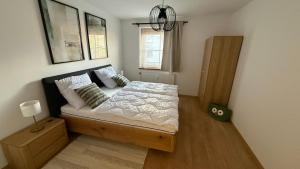 Ένα ή περισσότερα κρεβάτια σε δωμάτιο στο Alpine Oasis