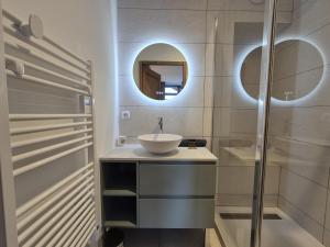 a bathroom with a sink and a mirror at Élégant Duplex - Sainte Foy Station - 10 pers in Sainte-Foy-Tarentaise +17 photos