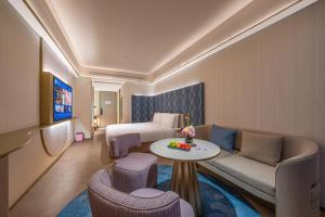 Ένα ή περισσότερα κρεβάτια σε δωμάτιο στο Nanyang Municipal Government Manxin Hotel