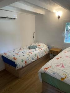 En eller flere senge i et værelse på Casita Tierra De Suerte