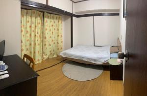 En eller flere senge i et værelse på Tokyo Kakan + 18 billeder