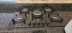 a stove top with four burners on top of it at Casa próximo ao lago - 1 in Boa Esperança