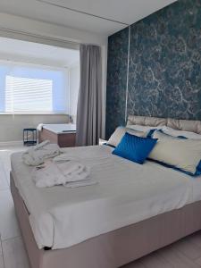 Postel nebo postele na pokoji v ubytování Suite La Perla Nera