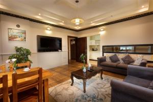 Un televizor și/sau centru de divertisment la Hotel Gardenz View 1