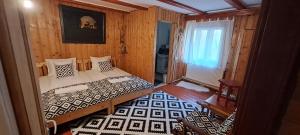 En eller flere senge i et værelse på Casa Baciu, Ciungetu-Vâlcea