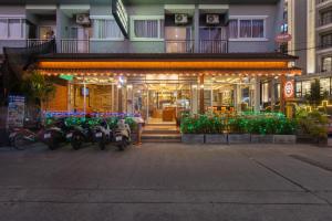 a group of motorcycles parked in front of a building at Baan KetKaew Patong in Patong Beach