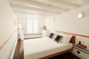 Ένα ή περισσότερα κρεβάτια σε δωμάτιο στο Ca' Dadda