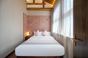 Ένα ή περισσότερα κρεβάτια σε δωμάτιο στο Peking Courtyard Qianmen