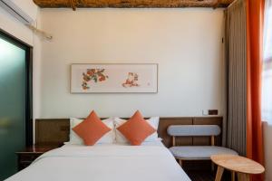 Ένα ή περισσότερα κρεβάτια σε δωμάτιο στο Peking Courtyard Qianmen