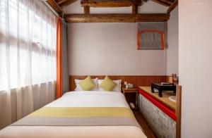 Ένα ή περισσότερα κρεβάτια σε δωμάτιο στο Peking Courtyard Qianmen