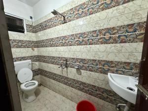 Koupelna v ubytování Hotel Anandam Residency + 24 fotografií