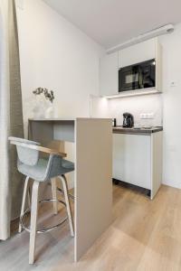 Η κουζίνα ή μικρή κουζίνα στο Square Rooms by Charming