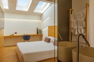 Ένα ή περισσότερα κρεβάτια σε δωμάτιο στο Habitat Boutique Hotel