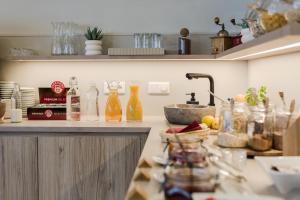 a kitchen with a counter with bottles on it at Hotel Restaurant Platzer in Gmünd in Kärnten