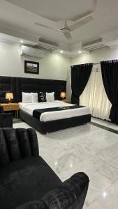 Postel nebo postele na pokoji v ubytování Grand Villa by Oslo Rezidor