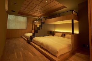 Postel nebo postele na pokoji v ubytování UCHIWA STAY Osaka NAMBA + 32 fotografií