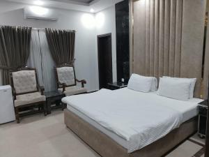 Postel nebo postele na pokoji v ubytování Grand Villa by Oslo Rezidor