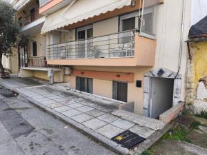 an empty street in front of a building at Michaniona apartment in Nea Michaniona
