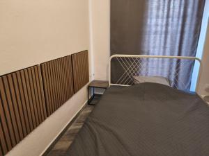 a hospital bed in a room with a window at Michaniona apartment in Nea Michaniona