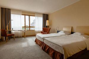 Postel nebo postele na pokoji v ubytování Hotel Remarque