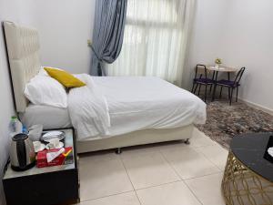 Ένα ή περισσότερα κρεβάτια σε δωμάτιο στο Mira