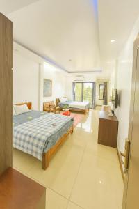 Ένα ή περισσότερα κρεβάτια σε δωμάτιο στο Hoàng Phương Hotel +28 φωτογραφίες