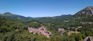an aerial view of a village in the mountains at Gite La Tanière in Siradan