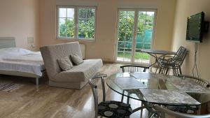 a living room with a couch and a table at Villa Valentina in Trpanj