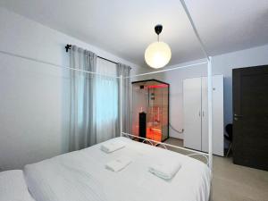 Ένα ή περισσότερα κρεβάτια σε δωμάτιο στο AmurResidence 531 private-Sauna free-parking