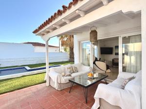 a living room with a view of the ocean at Villa near the ocean with private pool and garage in San Miguel de Abona