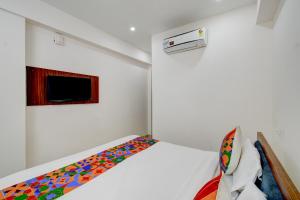 Postel nebo postele na pokoji v ubytování FabHotel RK Grand