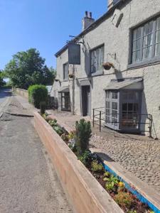 a street in front of a building at George of Piercebridge in Piercebridge