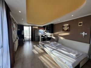 a bedroom with a large bed in a room at Art Apartments in Hajdúszoboszló