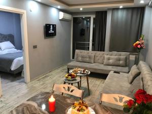 a living room with a couch and a bed at Nexus By Taksim Hotel in Istanbul