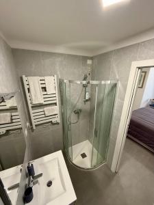 a bathroom with a shower and a sink at B&B Il Corallo in San Benedetto del Tronto +51 photos
