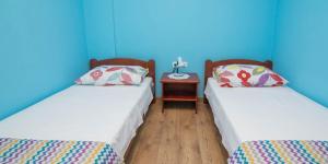 En eller flere senge i et værelse på Jasna B4 apartman