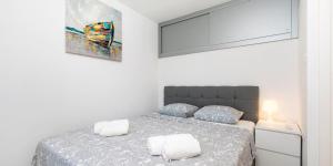 En eller flere senge i et værelse på Vacation house Orange