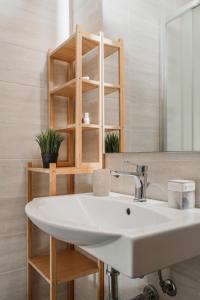 a bathroom with a sink and a mirror at Residence Hotel Piccadilly in Rimini +39 photos