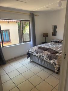 Ένα ή περισσότερα κρεβάτια σε δωμάτιο στο Shelly Bay House