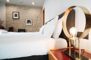 Ένα ή περισσότερα κρεβάτια σε δωμάτιο στο DownTown Boutique House - CA Domus Collection