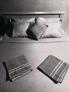 Ένα ή περισσότερα κρεβάτια σε δωμάτιο στο Madiha The Black Empire