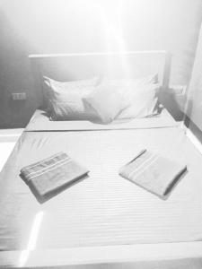 Ένα ή περισσότερα κρεβάτια σε δωμάτιο στο Madiha The Black Empire +64 φωτογραφίες