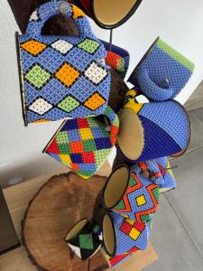 a group of colorful items on a table at Dung Beetle Bush Villa in Marloth Park